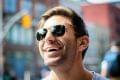 Nick C. Men in dark glasses with big smile.
